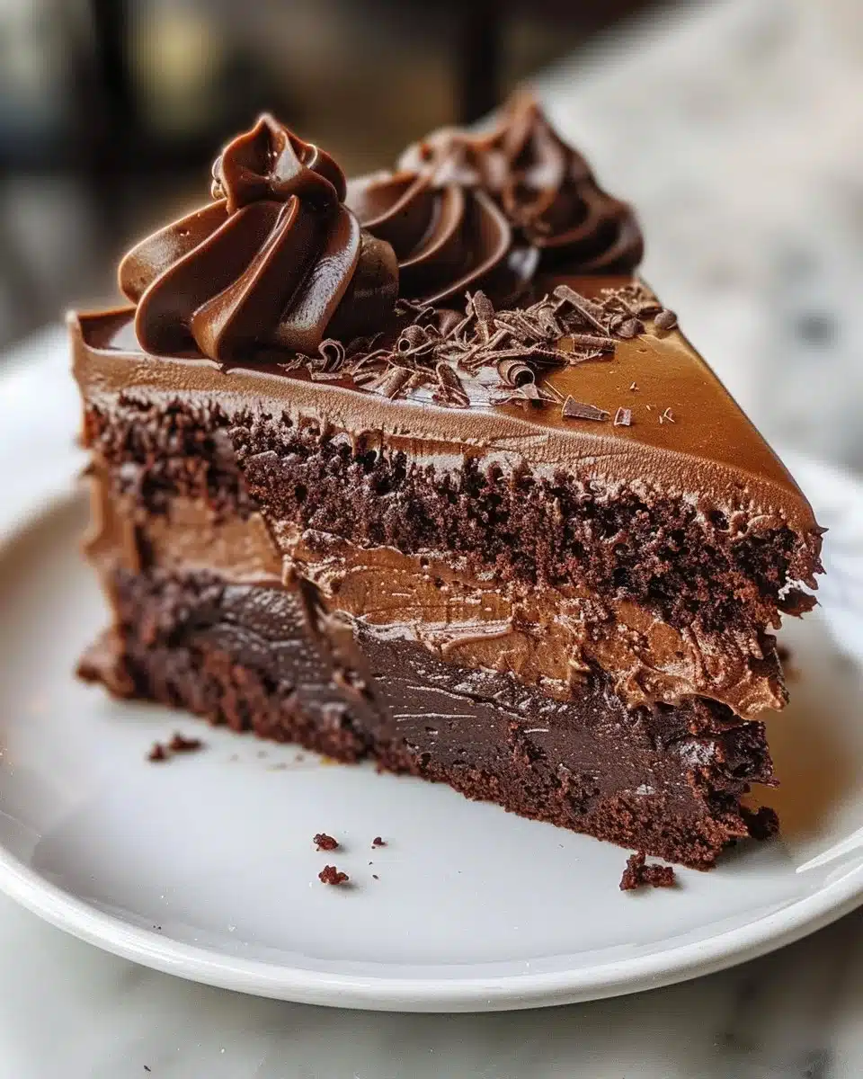 Delicious homemade chocolate cake topped with chocolate frosting and decorative sprinkles