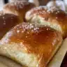 Freshly baked homemade soft pretzels on a wooden table