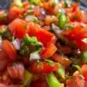Bowl of flavorful Italian stewed tomatoes with herbs and spices