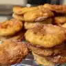Tray of freshly baked lemon ginger cookies on a rustic wooden table