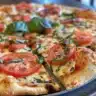 Delicious Margherita Flatbread Pizza with fresh tomatoes and basil