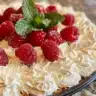 Mini no-bake cheesecakes topped with fruit and whipped cream