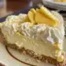 No Bake Mango Cheesecake Cups topped with fresh mango slices