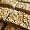 Freshly baked no-knead honey oat bread with a golden crust.