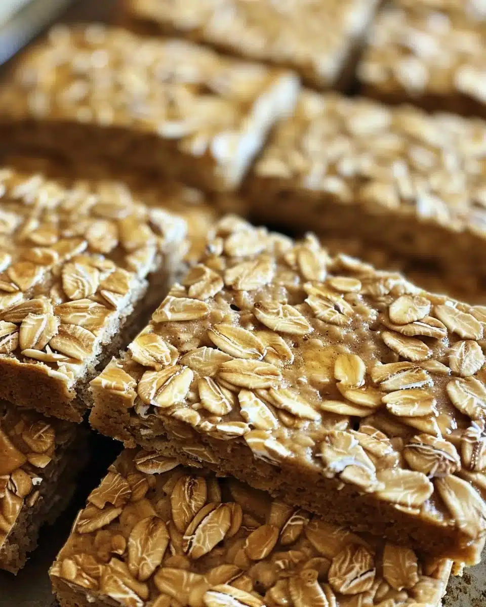 Freshly baked no-knead honey oat bread with a golden crust.