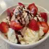 Roasted strawberry whipped ricotta toast topped with fresh strawberries and mint.