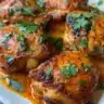 Delicious Slow Cooker Butter Chicken garnished with fresh cilantro.