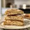 Delicious slice of Sour Cream Coffee Cake on a plate with coffee