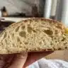 Homemade sourdough starter in a glass jar with flour and water