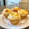 Fluffy Southern biscuits freshly baked on a rustic wooden table
