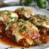 Spicy meatball appetizer served with sweet and tangy sauce on a platter.