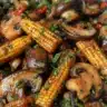 Stir-fried mushrooms with baby corn in a colorful bowl