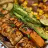 Delicious barbecue chicken served in a bowl with sweet potatoes and vegetables