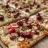 Brie and Cranberry Flatbread topped with fresh herbs