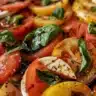 Delicious Caprese Salad topped with a rich balsamic reduction sauce.
