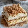 Delicious caramel apple cheesecake bars topped with caramel drizzle and apple slices
