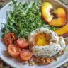 Charred Peach and Burrata Salad with greens and dressing