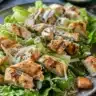 Delicious Chicken Caesar Salad Wraps with fresh lettuce, grilled chicken, and Caesar dressing.