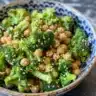 Chickpea Broccoli Stir-Fry served in a bowl with fresh vegetables