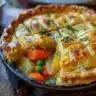 Classic chicken pot pie with flaky crust and savory filling of chicken and vegetables