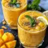 Coconut Mango Chia Pudding served in a glass with fresh mango slices on top.