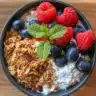 Healthy Cottage Cheese & Berry Power Bowl topped with fresh fruits and seeds.