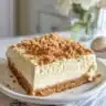 Delicious creamy peach cheesecake bars served on a plate.