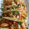 Crispy Buffalo chicken wraps with ranch slaw on a plate