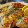 Crispy oven-roasted spatchcock chicken served with herbs and spices