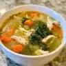 Bowl of healthy detox soup made with fresh vegetables and herbs
