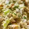 Bowl of easy chicken salad with fresh vegetables and dressing