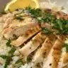 Bowl of delicious homemade Egg Lemon Soup with herbs and lemon slices