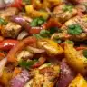 Fajita chicken foil packet dinner with colorful peppers and onions
