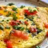 Delicious vegetable frittata served on a plate, ready to enjoy for breakfast or brunch.