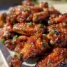 Delicious garlic-honey glazed chicken wings on a plate