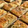 Gluten-free focaccia bread topped with herbs and olive oil