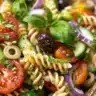 Bowl of colorful Italian Pasta Salad with vegetables and herbs