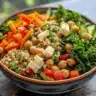Delicious Kale Salad with Chickpeas and Quinoa in a vibrant bowl