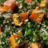 Colorful Kale Sweet Potato Salad with Quinoa and Dijon Dressing in a bowl