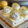 Mini no-bake lemon cheesecake tarts topped with fresh lemon zest