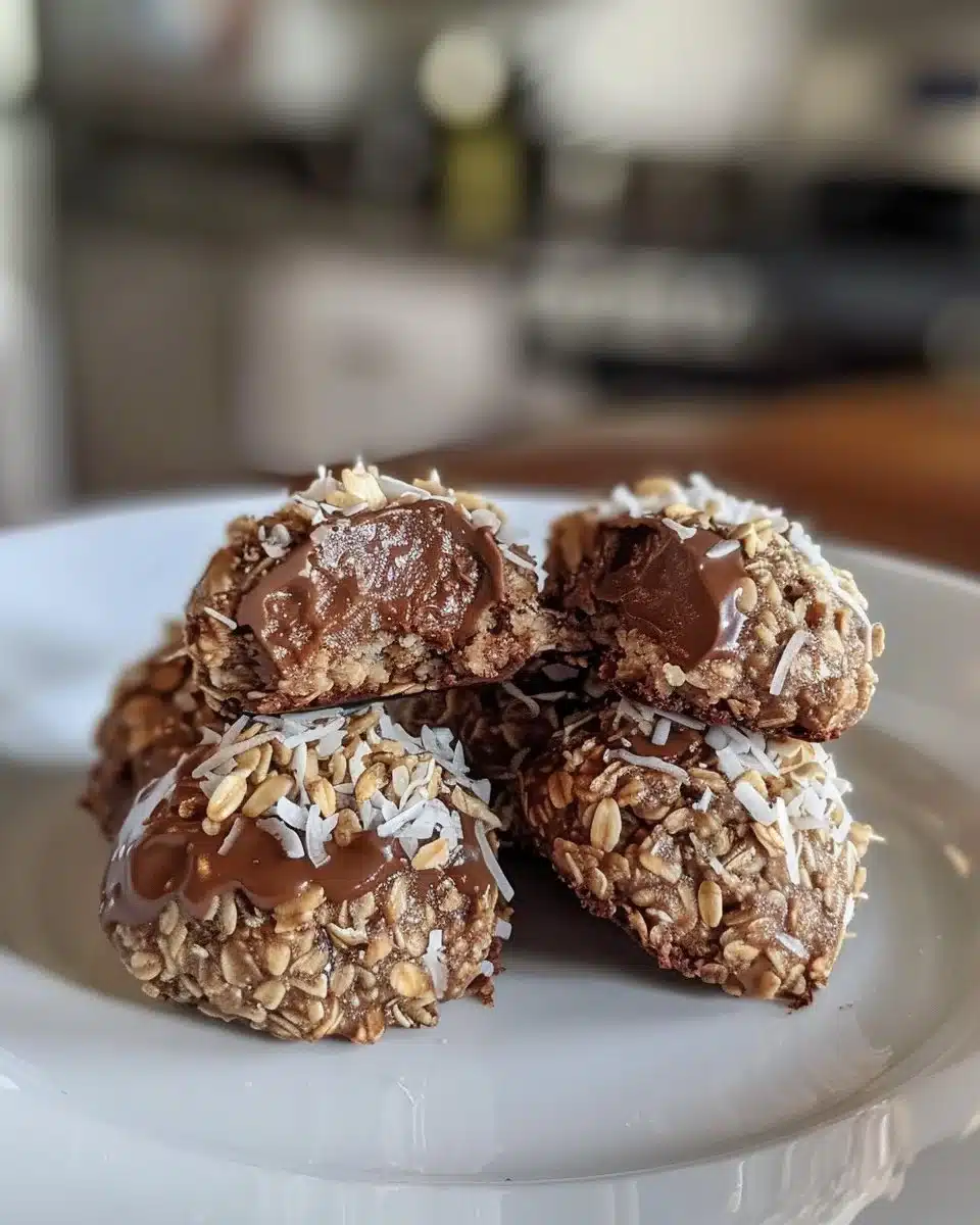 No bake chocolate coconut energy bites in a bowl with coconut flakes