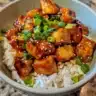 One-Pan Honey BBQ Chicken served with rice and garnished for a flavorful meal.