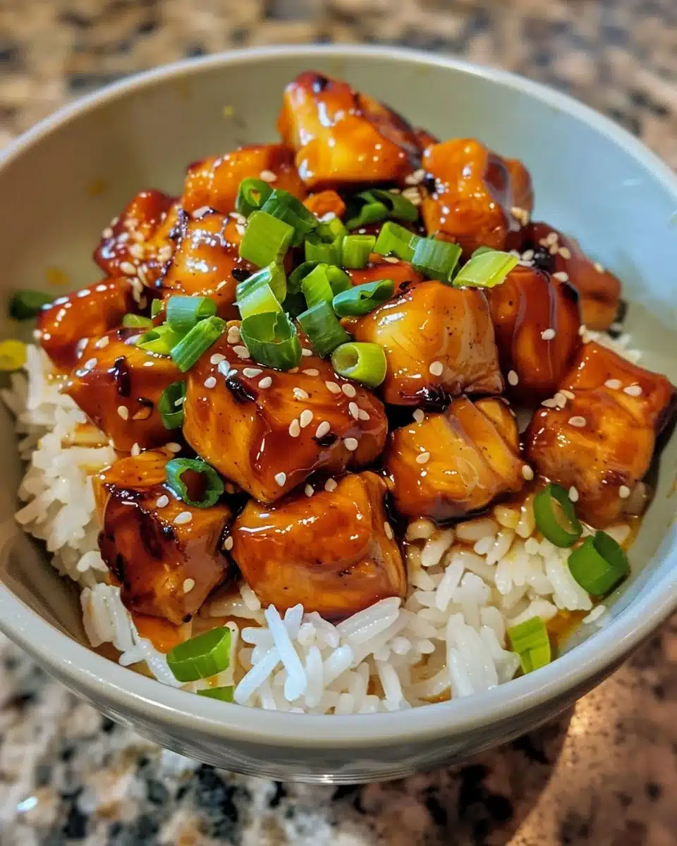 One-Pan Honey BBQ Chicken served with rice and garnished for a flavorful meal.