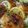 One Pot Greek Chicken and Rice dish garnished with herbs