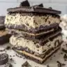 Oreo-cookie crust peanut butter cheesecake slice on a plate