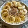 Delicious bowl of overnight oats topped with brown sugar and fresh fruit