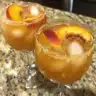 Delicious Peach Bellini Slush made with fresh peaches and sparkling wine.