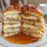 Pecan pie-inspired cinnamon rolls drizzled with caramel glaze