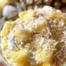 Pina Colada smoothie with tropical fruits in a glass