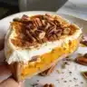 Pumpkin Stuffed French Toast topped with a crunchy pecan crust on a plate